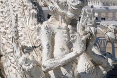 Outside the temple is covered in statues of demons and writhing hands and faces.