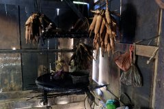 Various things being dried above the fire