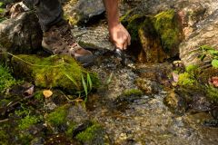 Refilling our water bottle at the spring.