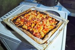 Unfortunately the lighting makes our pizza look radioactive.